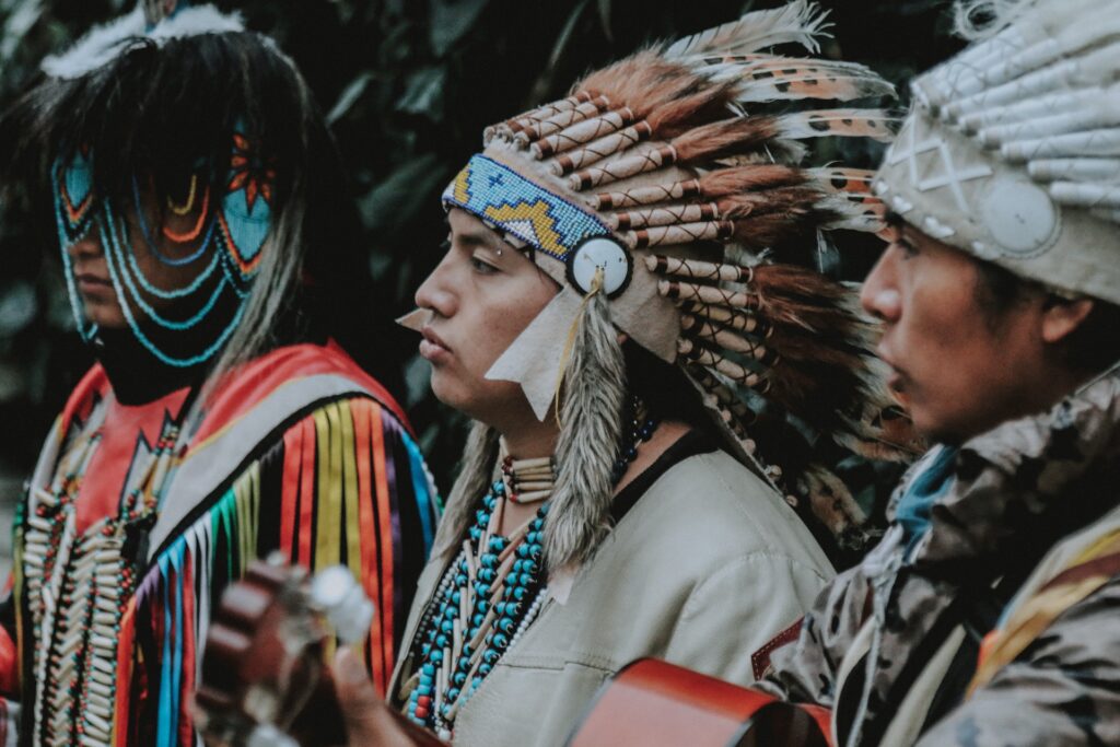 Three men in Native American clothing