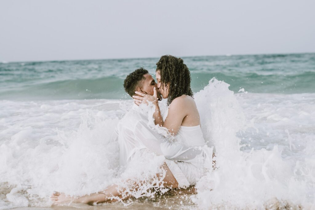 Couple kissing in the ocean