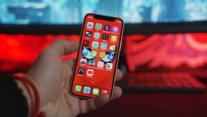 Hand holding an iphone 12 mini