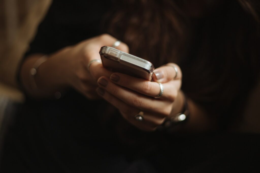 Woman's hands holding a phone