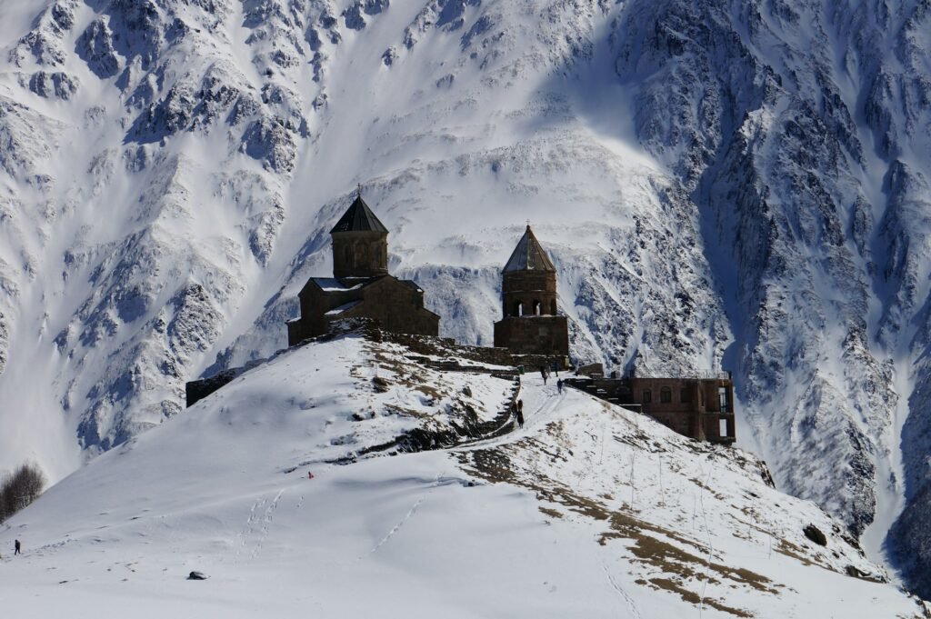 Mkinvartsveri monastery on top of a snowy peak in Georgia